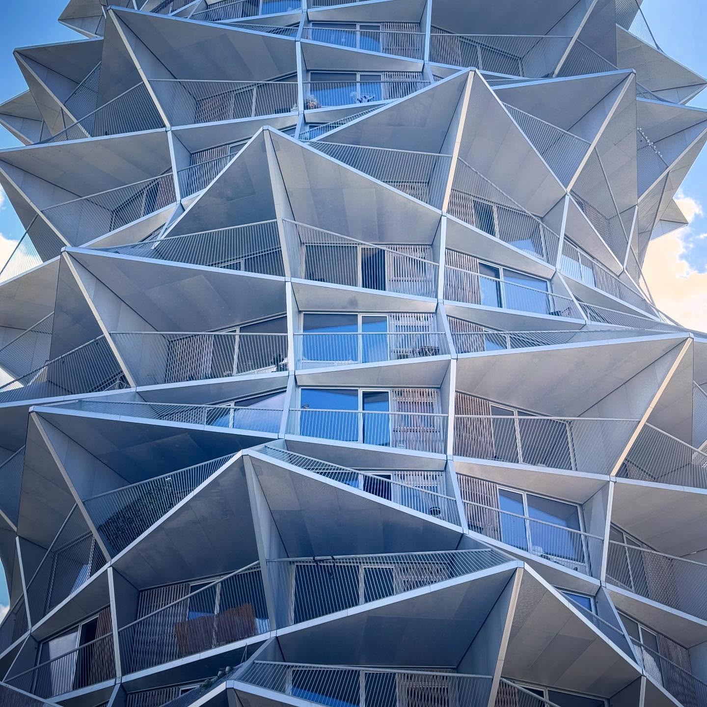 Angular balconies and glass façades at the Cactus Towers.