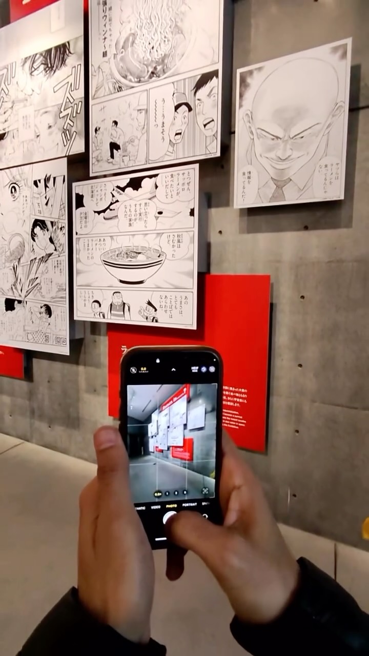 Reel cover showing a visit to a concrete-walled exhibition.
