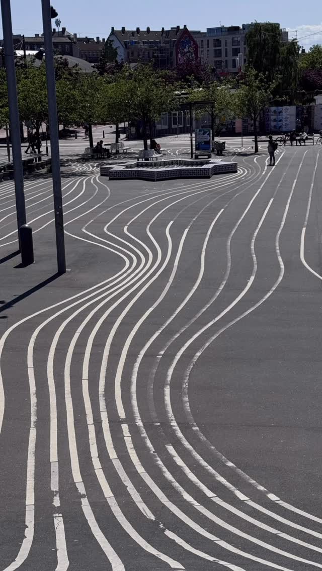 Reel cover showing the striped ground surface and public space at Superkilen.