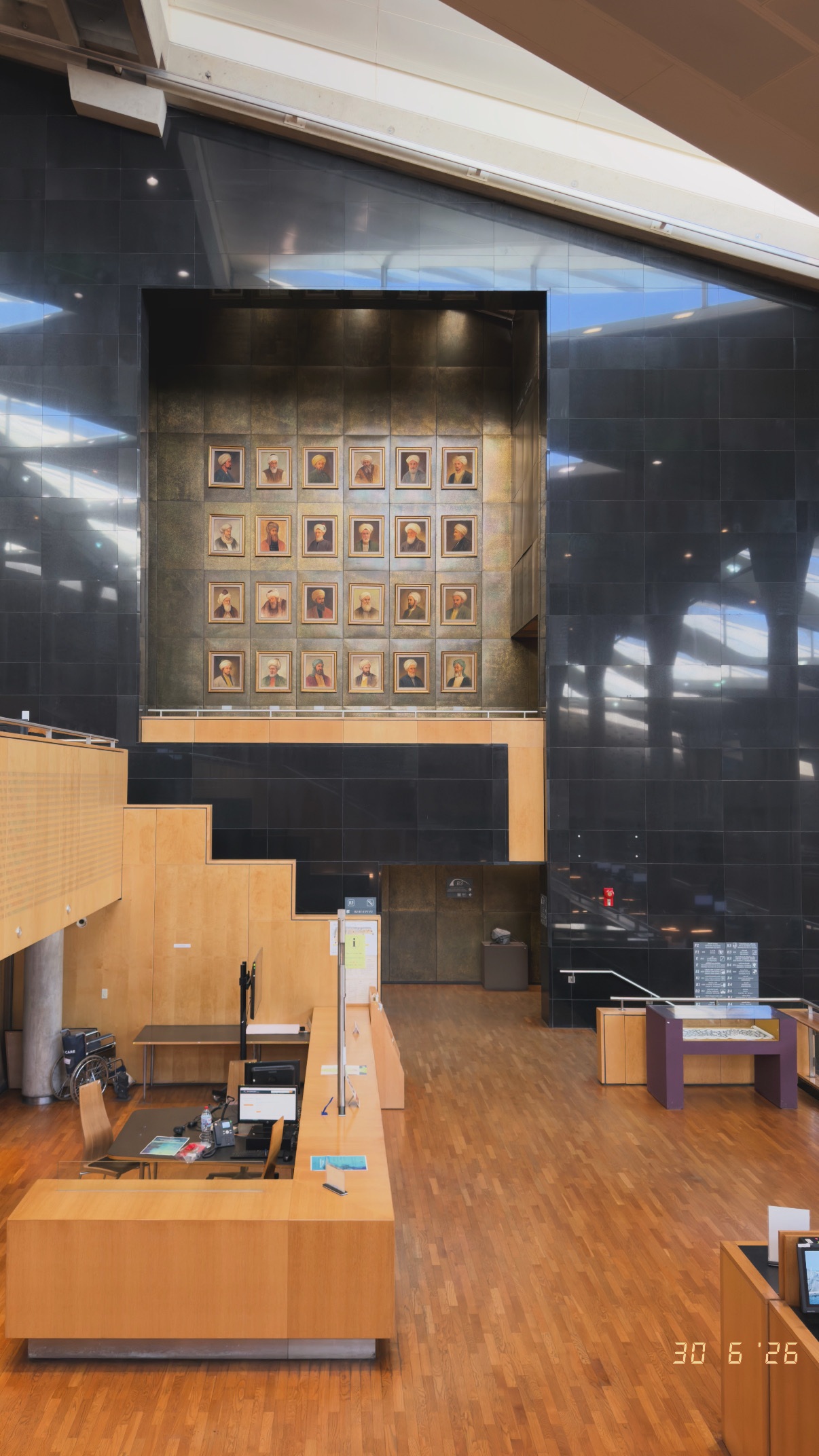 A quiet desk beneath the collection. Bibliotheca Alexandrina.