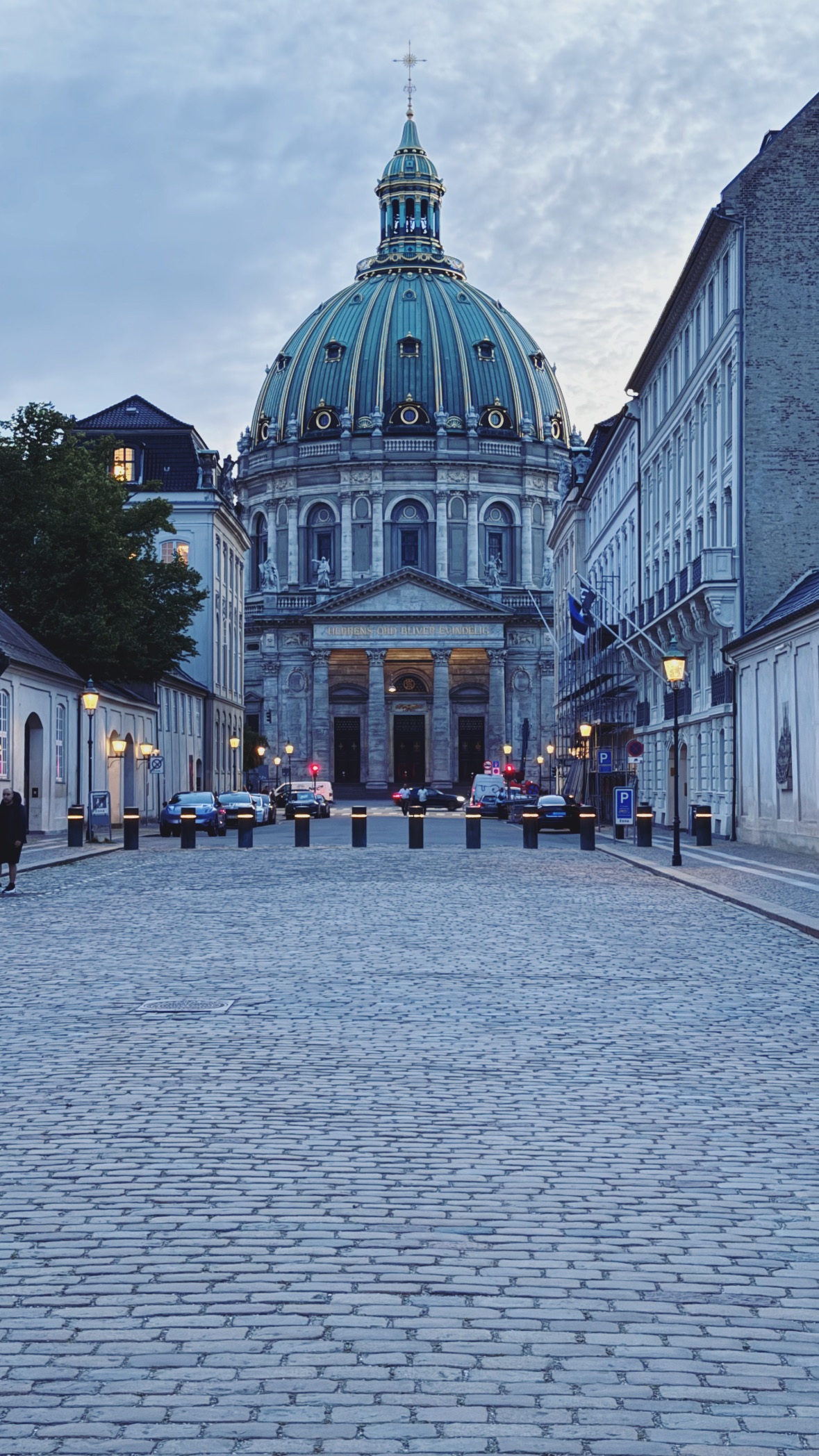 A dome at the end of the street. City and interiors.