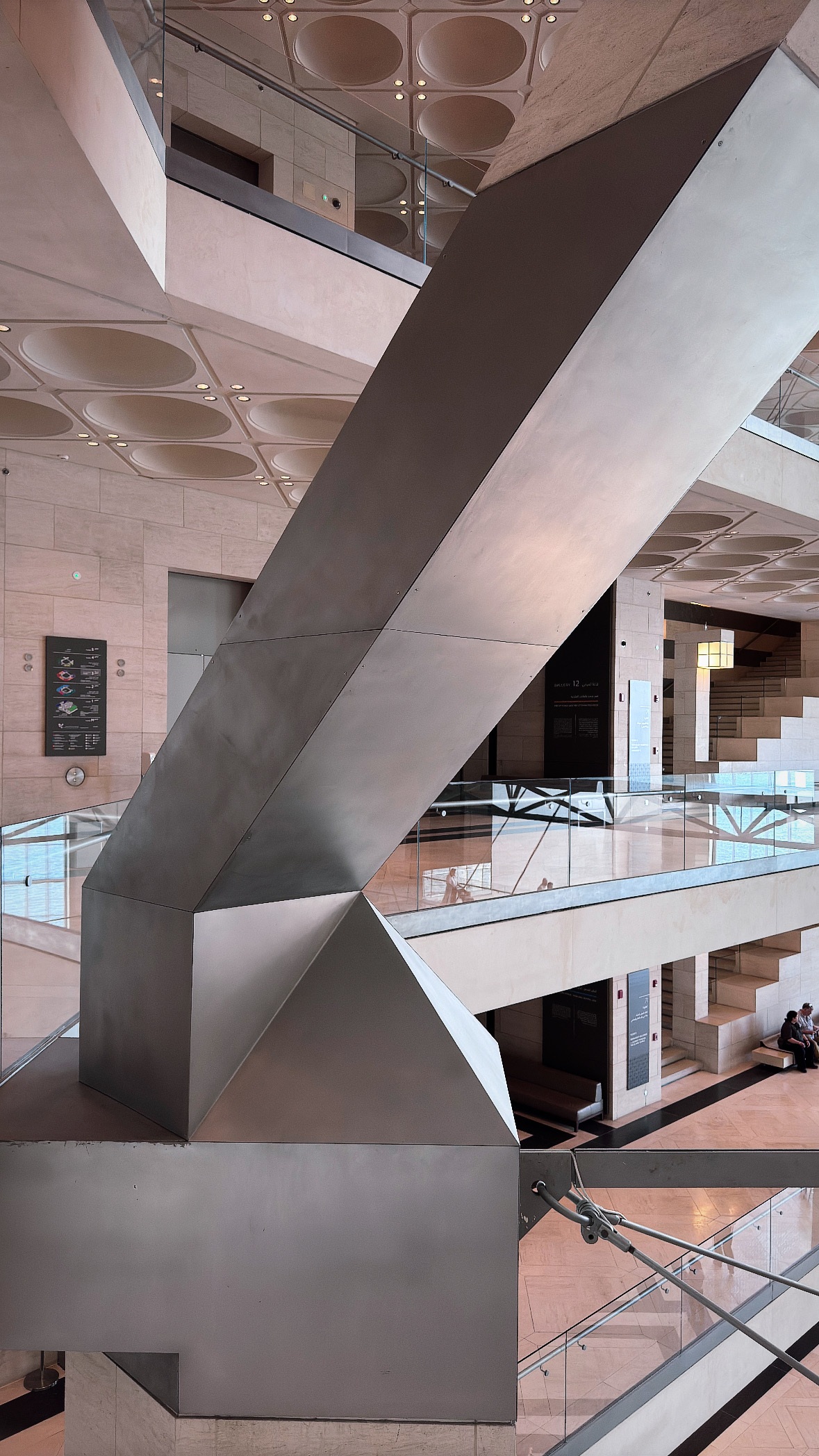Stairs crossing the void. Museum of Islamic Art.