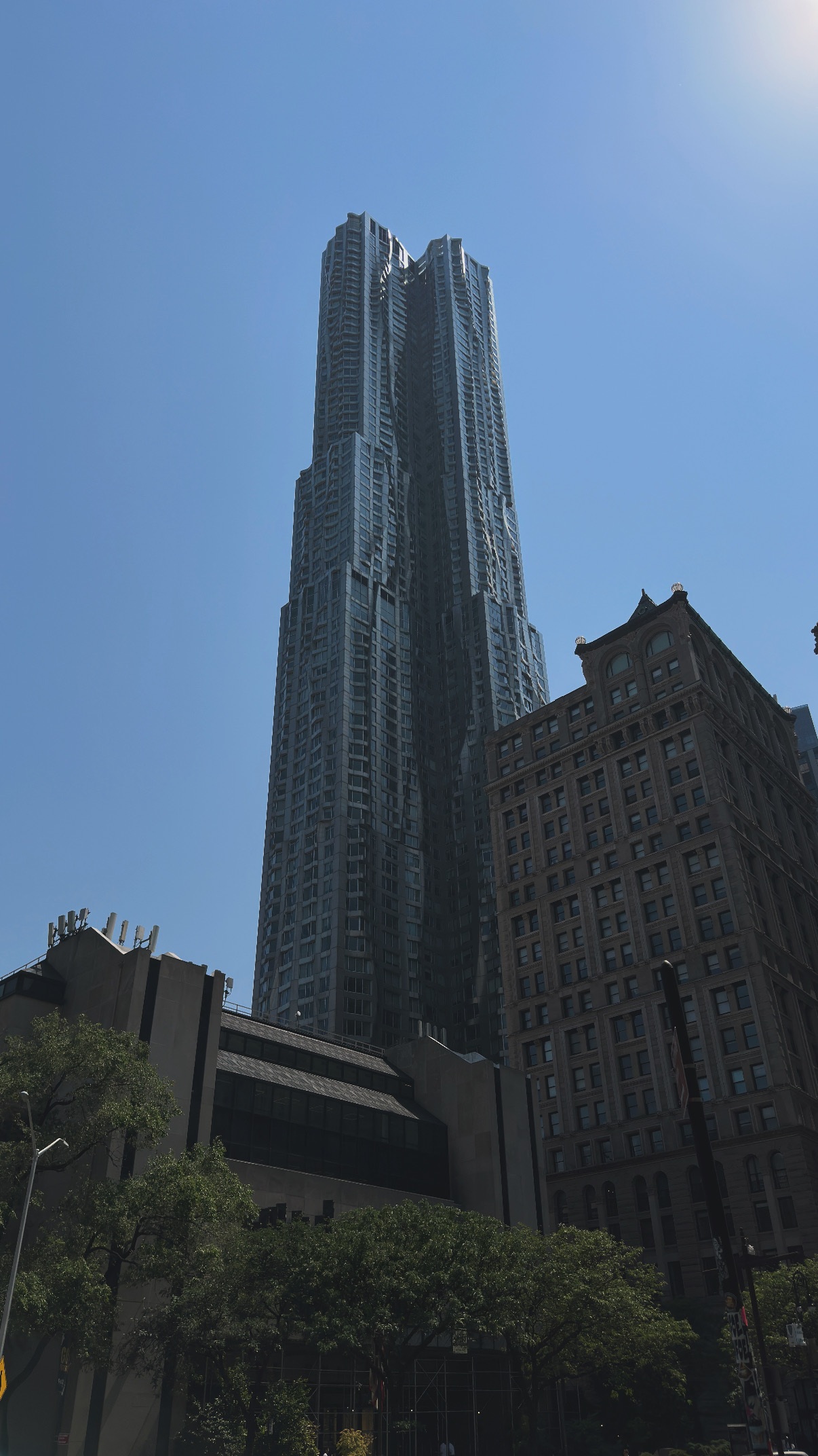 A tower above older streets. Midtown and Lower Manhattan.