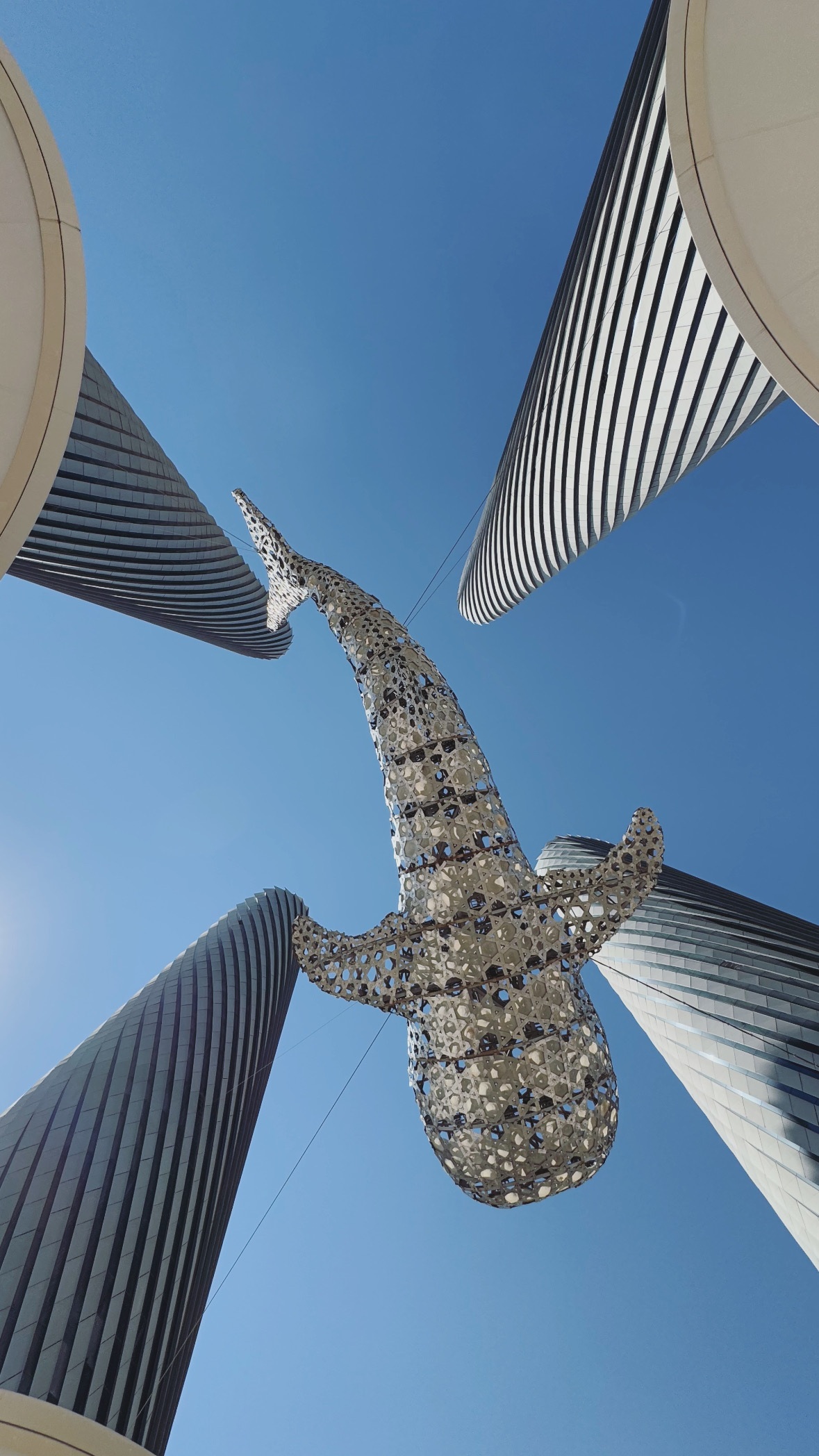 Towers and a suspended form. Doha and Lusail.