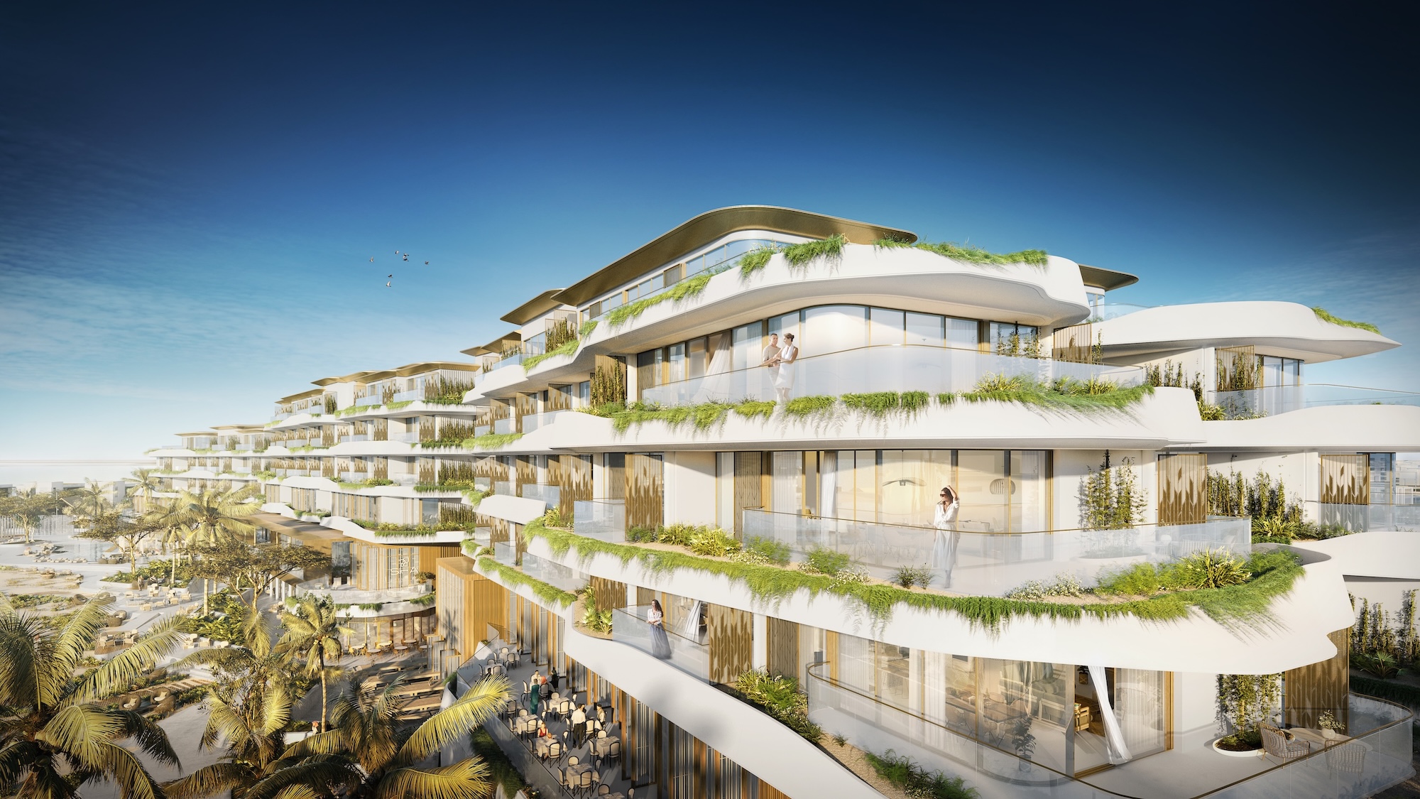 White terraces, curved balconies and dense planting in the BSBG SHA Emirates scheme.