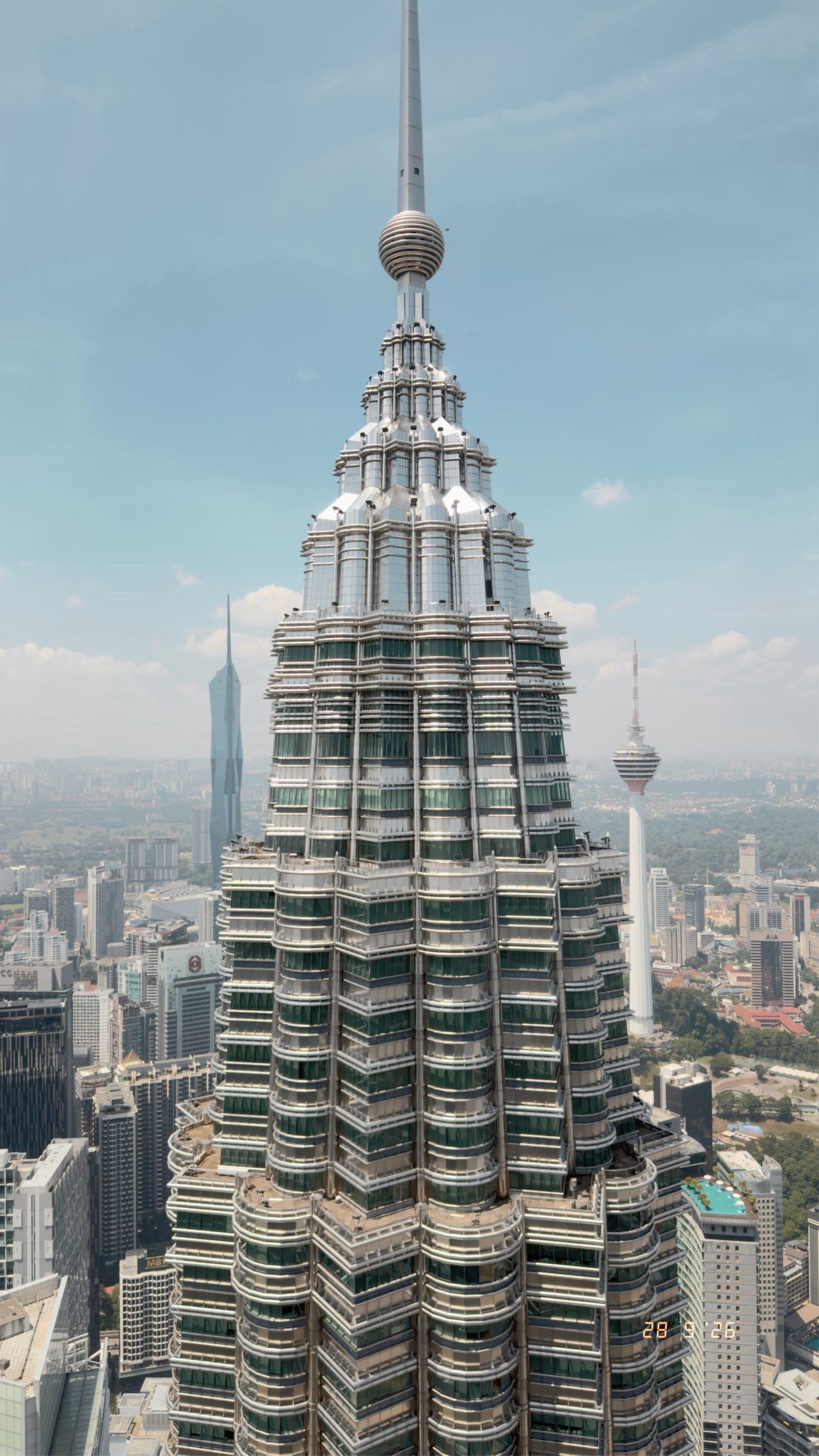 The Petronas Towers across the daytime skyline