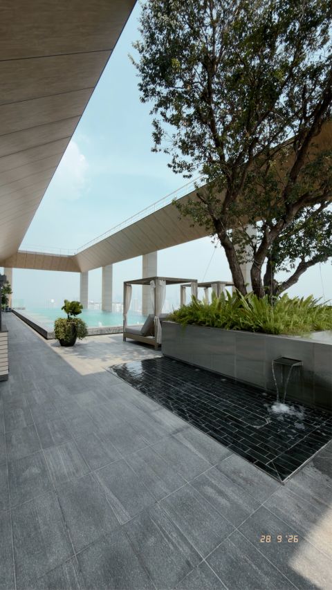 A shaded terrace above the city