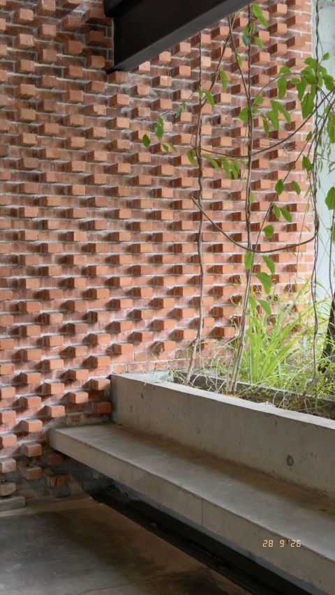 Perforated brick and a shaded bench