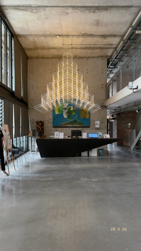 A gathering space beneath the concrete roof